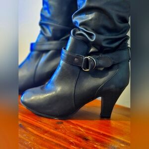 Black leather high heel boots